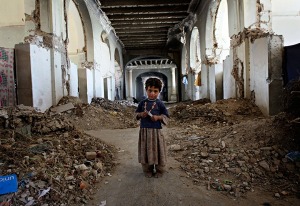 An Afghan girl stands in the ruins of Darulaman Palace, on the outskirts of Kabul, in October 2010.